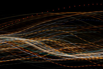 graphic design lines long exposure of lights creating straight, wavy and dotted colorful lines pattern
