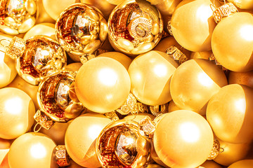 Heap of Golden Christmas balls, may use as Background. Close up. Traditional Xmas and Happy New Year  Symbol.