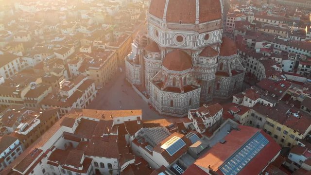 In Florence Italy, the drone moves around the Duomo and displays the Piazza surrounding the Duomo.
