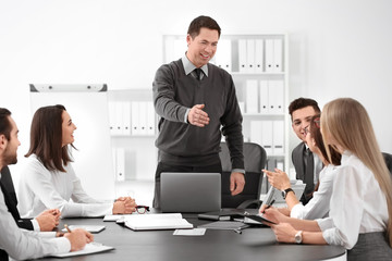 Group of people with business trainer at management seminar