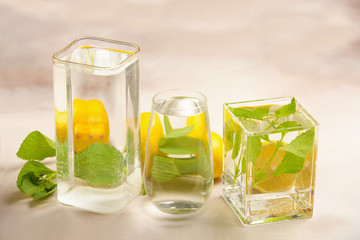 Foods distorted through liquid and glass on light background.