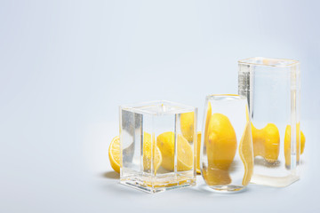 Foods distorted through liquid and glass on blue background.