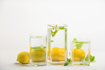 Foods distorted through liquid and glass on white background.
