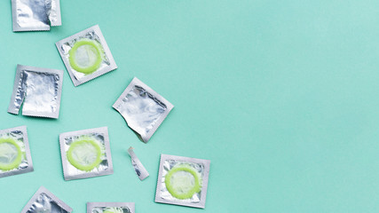 Fototapeta na wymiar Flat lay wrapped condoms with copy-space