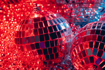 Mirror balls reflecting lights close up, nightlife background