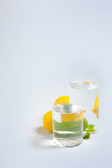 Foods distorted through liquid and glass on blue background.