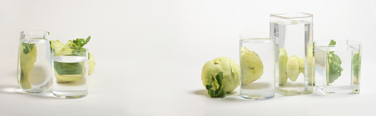 Foods distorted through liquid and glass on white background.