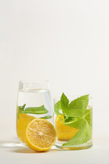 Foods distorted through liquid and glass on white background.