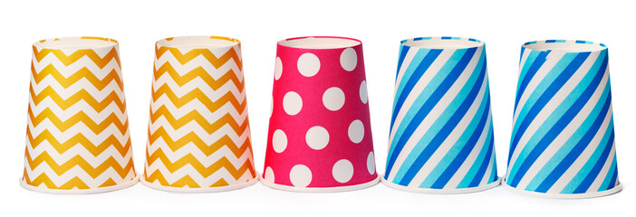 Obraz premium Paper disposable cups with colored pattern isolated on white background