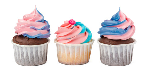 Three yummy cupcakes with icing  isolated on white background