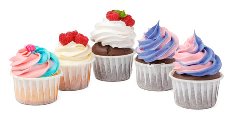 Group of cupcakes with colored topping isolated on white background