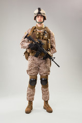 United states Marine Corps special operations command  raider with weapon. Studio shot