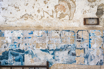 Faded articles on the wall of the abandoned prison in ex Yugoslavia