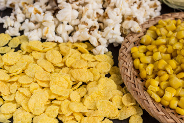 Cooked corn, popcorn and cornflakes. Close up.