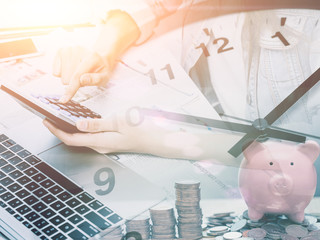 Business with Time concept - Calculator with Clock for remind urgent money payment or cost...