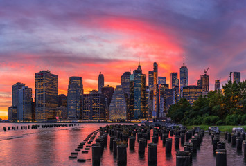 Sunset at Brooklyn Bridge Park with the view to Manhattan skyline.
