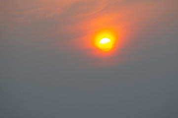 Sunrise sky covered with haze , making it look unusual