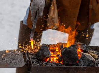 Burning black coal at the blacksmith