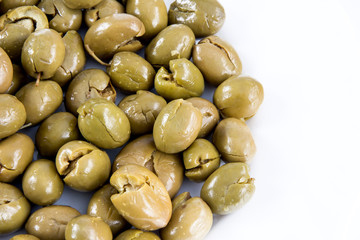 Green olives on white background
