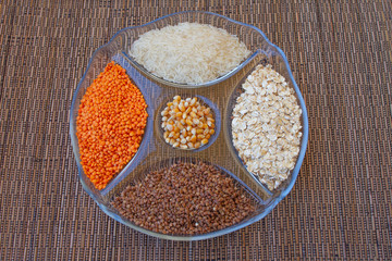 groats buckwheat lentils rice corn oatmeal on a white background