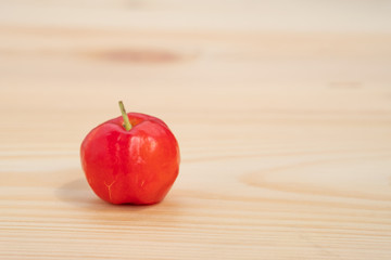 Acerola cherry of thailand on wood. Select  focus, Barbados cherry, Malpighia emarginata, high vitamin . Acerola fruit.