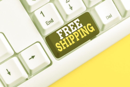 Word writing text Free Shipping. Business photo showcasing Freight Cargo Consignment Lading Payload Dispatch Cartage White pc keyboard with empty note paper above white background key copy space