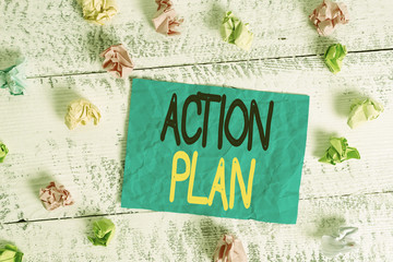 Word writing text Action Plan. Business photo showcasing detailed plan outlining actions needed to reach goals or vision Crumpled colored rectangle square shaped paper reminder white wood desk