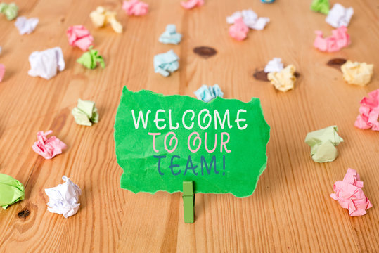 Word writing text Welcome To Our Team. Business photo showcasing introducing another demonstrating to your team mates Colored crumpled papers empty reminder wooden floor background clothespin