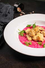 risotto chicken meat (red rice with beetroot flavor) menu concept. food background. copy space. Top view