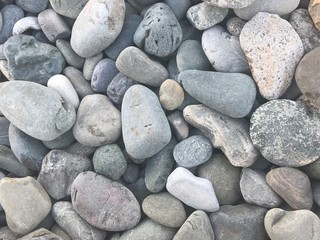 large gray stones on the beach