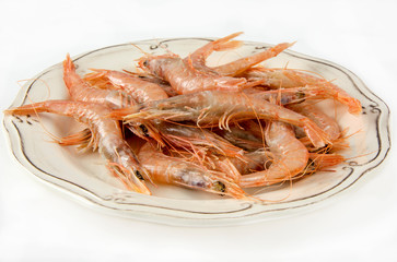 Several raw prawns served on a plate