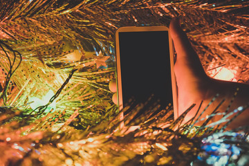 Smartphone with the empty dark screen in the child's hands