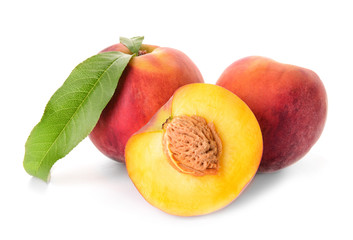 Ripe peaches on white background