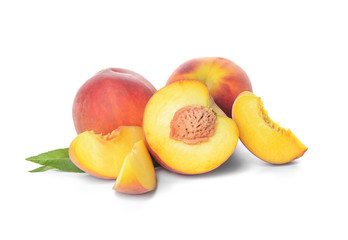 Ripe peaches on white background