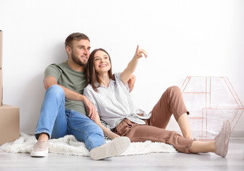 Young couple planning design of their new house