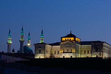 Fototapeta na wymiar Lighted domes of Kul Sharif Mosque in the evening in Kazan Russia