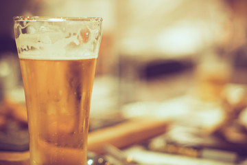 cold beer on counter bar, retro tone