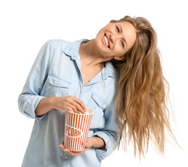 Young woman with popcorn on white background