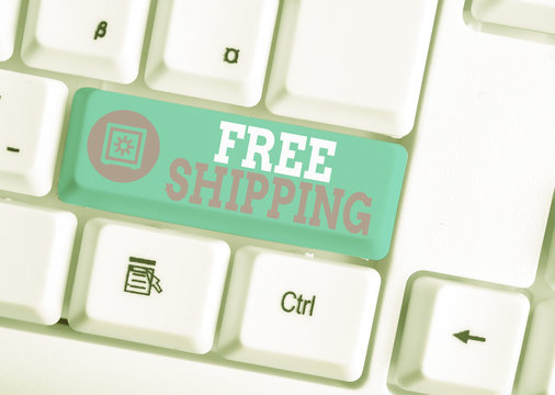 Writing note showing Free Shipping. Business concept for Freight Cargo Consignment Lading Payload Dispatch Cartage White pc keyboard with note paper above the white background