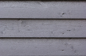 Wooden plank background of gray wall building