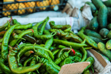 Fresh chili peppers on counter at market