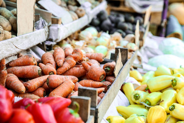 Assortment of fresh vegetables on counter at market