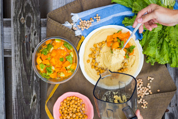 Original homemade arabic chickpea hummus with olive oil and cumin. Creamy dip paste.
