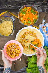 Original homemade arabic chickpea hummus with olive oil and cumin. Creamy dip paste.