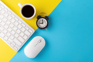 Computer keyboard and mouse with clock and coffee cup