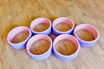 All kinds of Yoga props are on the wooden floor of the yoga studio. Conveyor belts, mats and cushion blocks are in the yoga center. The concept of health activities