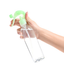 Female hand with bottle of air freshener on white background