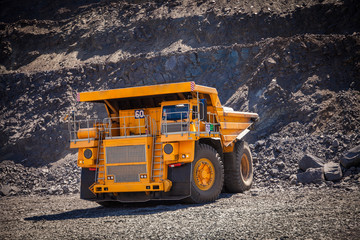 yellow dump truck in the quarry