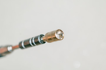 Micro screwdriver with nozzle for working with electrical equipment