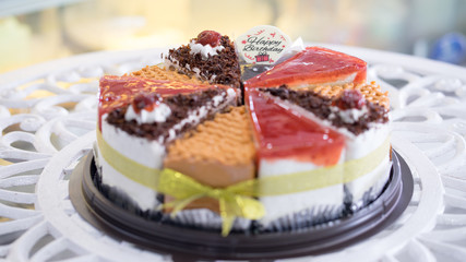 Many types of cakes combined into pounds for Happy Birthday